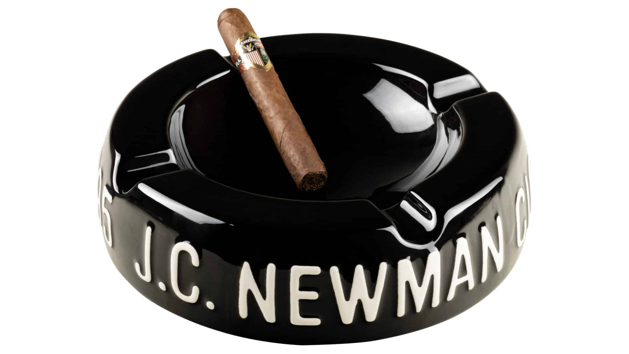 j.c. newman vintage ashtray with one american cigar unlit