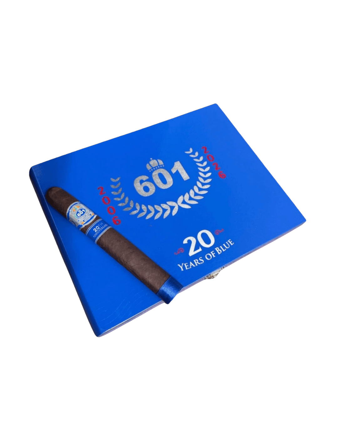 601 Cigars. 20 years of blue closed cigar box with one single unlit cigar on top of limited-edition cigars box
